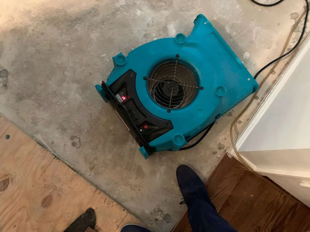 Air mover drying subfloor during Leak Detection & Repair in Malvern