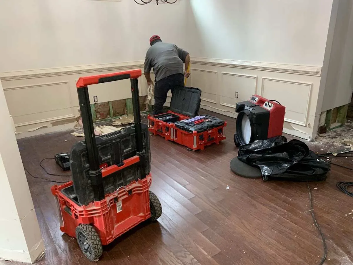 Technician setting up drying equipment for water damage in Malvern
